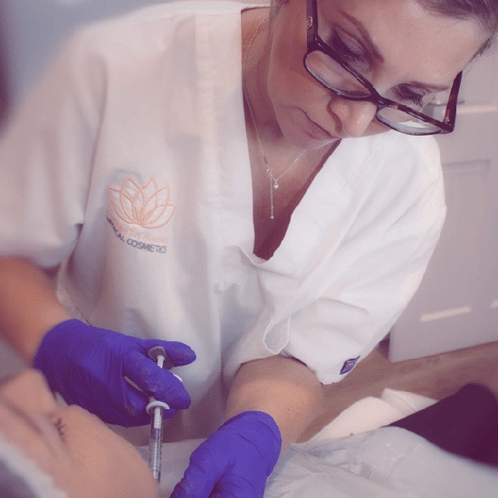 Elizabeth Harris performing a treatment on a patient at her Aesthetic Clinic in Cowes on the Isle of Wight.